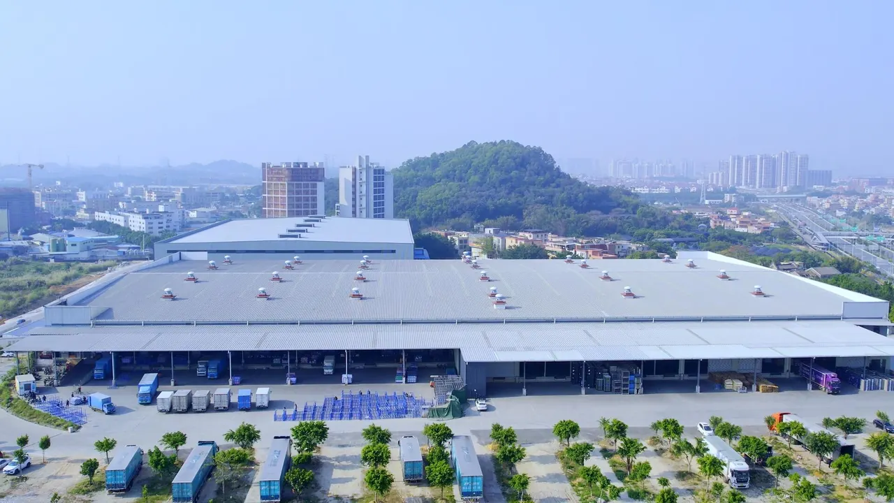 Aerial view of a logistics hub with loading bays and freight vehicles