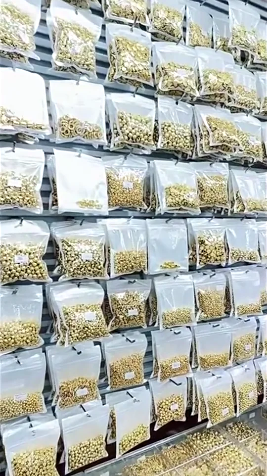 Organized jewelry components in transparent supplier packs
